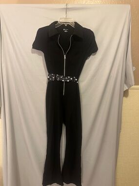 Black Short-Sleeve Zip-Front Cat Jumpsuit. Stretch bell and sleek form fit